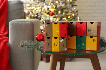 Wall Mural - Advent calendar with Christmas branches on table in living room, closeup