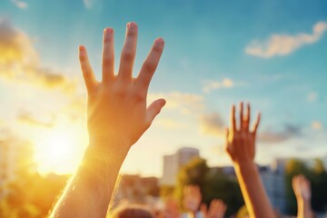 Poster - A hand is raised in the air with the sun shining on it