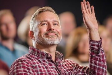 Canvas Print - A man in a plaid shirt is smiling and waving at the camera