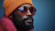 © Prompt World - Fashion portrait of a man in orange beanie and sunglasses with colorful lighting