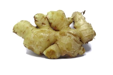 A close-up of a fresh ginger root. The root is light brown in color and has a knobby, irregular shape. It is isolated on a white background.