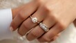 © Kritsada - A couple holding hands with engagement rings visible, symbolizing the promise of marriage, engagement rings, love and commitment