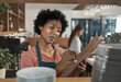 © peopleimages.com - Cafe, business woman and notes with clipboard for inspection, management and inventory tracking. Restaurant, female person and barista with checklist for tick, information and invoice for manager