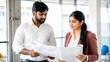 © N7 - Indian Man and Woman Discussing Project Plans