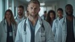 © Tahir AI - A team of doctors in their 20s-30s, walking in a movie-like group, shot from the front, camera away, chest out.