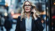 © Julia - Full body portrait of successful businesswoman in suit talking on smartphone, walking city urban street