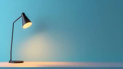 Wall Mural - Modern desk lamp illuminating a minimalist workspace against a soft blue background