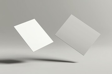 two blank business card mockups floating on a grey background with a soft shadow, two white round-co