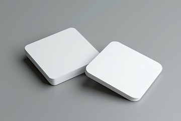 white blank business card mockup on a gray background, 3d rendering. two cards with rounded corners,