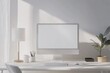 © ffunn - White desktop with computer mockup and accessories on it, against a white wall background. Minimalist home office interior design of a modern studio apartment or house. White screen