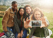 © peopleimages.com - Friends, happy and selfie of people in park for social media, online post and profile picture. Screen, weekend and men and women with photo for bonding on holiday, vacation and adventure in nature