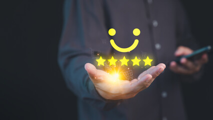 Fototapete - Person holding a glowing five-star customer review with a smile face, symbolizing high-quality service and positive customer satisfaction in online shopping, background features shopping cart icons.