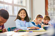 © Rido - Smiling middle eastern schoolgirl smiling in primary classroom