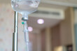 © Kwangmoozaa - Close up medical intravenous IV drip in hospital background