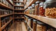 © familymedia - A pantry aisle displaying rows of glass jars filled with a diverse selection of dried foods like pasta and spices, exemplifying efficient food storage solutions.