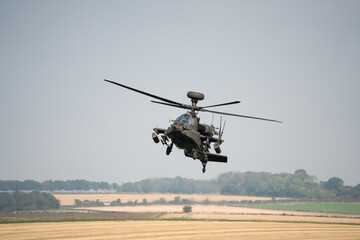 close-up front view of a British army Boeing Apache Attack helicopter gunship AH64E AH-64E ArmyAirCorp in low level flight