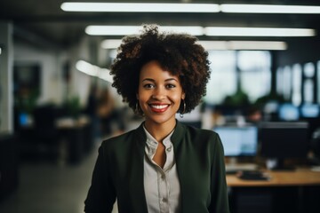 Wall Mural - Smiling portrait of a young African American businesswoman in office