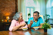 © StockImageFactory - Couple in their fifties enjoying homemade noodles together, sharing joy and good times at home