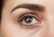 © Alexandra - Close-up of a female eye with long eyelashes after a beauty treatment, showing the effectiveness of the procedure