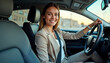 © Ali Hamza Tullah - Businesswoman fastening seat belt smiling before driving