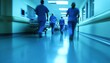 © Anastasiia - Healthcare professionals move swiftly down a hospital corridor during a busy shift