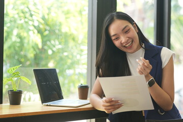 Asian woman succeeds at office