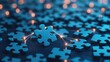 © Nitchalee N. - A close-up of a glowing puzzle piece being connected amidst a sea of blue puzzle pieces, symbolizing creativity and problem-solving.