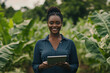© wolfhound911 - A young Black female agriculture engineer standing in a lush green field, holding a tablet that displays data on sustainable farming. Her confident expression reflects her innovative approach to
