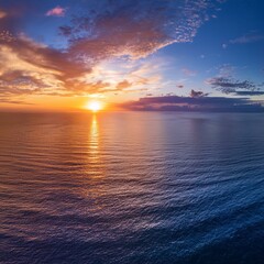 Wall Mural - aerial panoramic view of sunset over ocean colorful sky clouds water beautiful serene scene wide angle seascape drone view majestic stunning nature background best sea sky sunrise inspire views