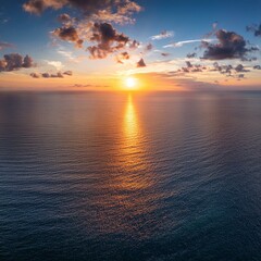 Wall Mural - aerial panoramic view of sunset over ocean colorful sky clouds water beautiful serene scene wide angle seascape drone view majestic stunning nature background best sea sky sunrise inspire views