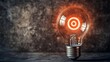 © Chronicles Artsy  - Glowing Lightbulb with a Target Design on a Concrete Background