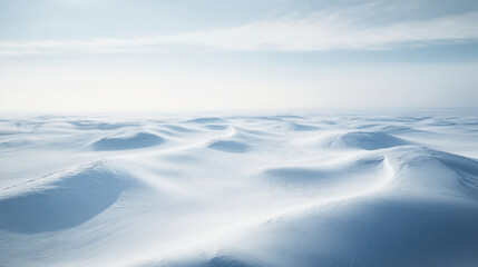 Wall Mural - Sun shining on a vast snow covered landscape, creating beautiful shapes in the snow