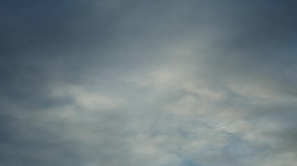 Wall Mural - simple time lapse of light blueish gray clouds moving across the sky, left to right