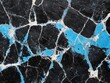 © Yotwarit - A textured surface featuring a cracked pattern in black and vibrant blue, creating a striking visual contrast and an abstract appearance.