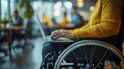 a person in a wheelchair with a laptop