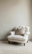 © jambulart - White armchair with pillow on rug.
