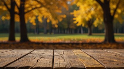 Beautiful colorful natural autumn background for presentation. Fallen dry orange leaves on wooden boards against the backdrop of a blurry autumn park.