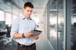 © BillionPhotos.com - Businessman portrait hold tablet computer in office