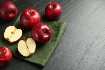 Canvas Print - Whole and cut ripe red apples on grey textured table, space for text