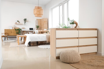 Canvas Print - Chest of drawers and pouf in interior of bedroom