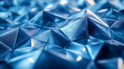 Leinwandbilder - A detailed view of a textured blue surface showcases intricate triangular shapes that create a dynamic interplay of light and shadow, enhancing its visual appeal.