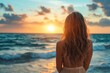 © Maelgoa - Young woman with long wavy hair, wearing a flowing dress, standing on the shore and looking at the sunset over the ocean 4