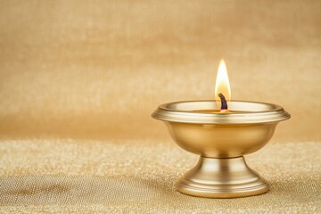 Poster - A gold candle holder with a single lit candle inside