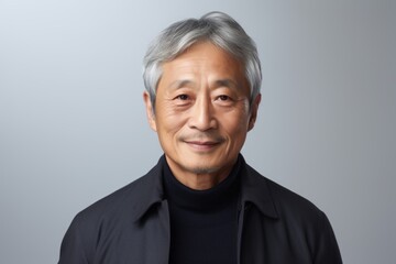 Wall Mural - asian senior man with grey hair and wearing black turtleneck