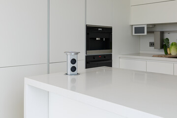 Pop up electrical socket on kitchen worktop.