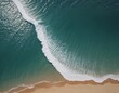 © kengkreingkrai - aerial view of a beach with a surfboard and a wave.