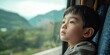© Goncharenko - Boy looking out train window