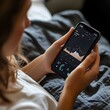 © HiSea - Woman Checking Phone in Bed with Data Analytics App