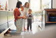 © peopleimages.com - Baking, oven and mother with children in kitchen for cake, treats and dessert for bonding, fun or relationship. Family, home and young girls with ingredients, recipe and learning together with tray