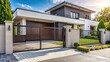 © yuwaree - Enhanced accessibility automatic gate fence driveway and house with garage for convenient entry minimalist